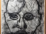 a black and white drawing of a man ' s face in a wooden frame