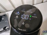 a black alarm clock sitting on top of a white counter