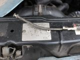 a close up of a car ' s engine with its hood open