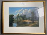 painting of a river with trees and clouds in a gold frame
