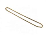 a gold chain on a white background