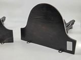 pair of black metal bookends on a white background