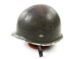 an image of a helmet on a wooden stand on a white background