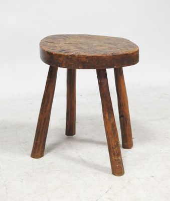 an image of a small wooden stool on a white surface