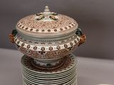 a stack of plates with a lid on top of it