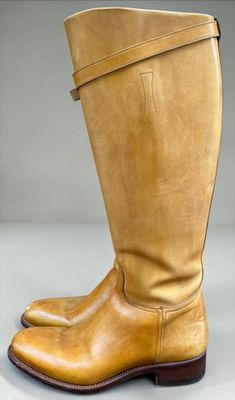 a close up of a pair of boots on a white surface
