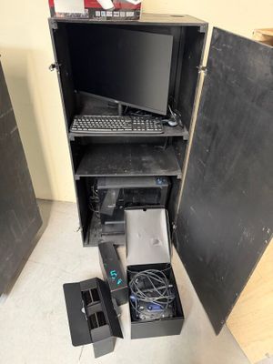 a computer that is sitting inside of a cabinet