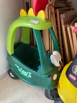 a small toy car and a small toy car in a room