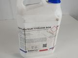 a white container with a blue lid on a white table