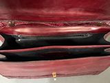 a red purse that is open on a table