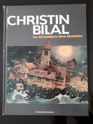 un livre sur lequel figure l'image d'un bateau sur l'eau