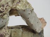 a figurine of a soldier holding a rifle