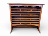 an antique oak bookcase with glass doors and shelves