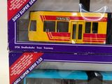 two toy trains in the boxes on the table