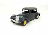 a toy car that is sitting on a white surface