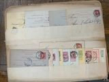 an old book with stamps on it sitting on a table