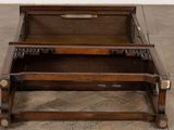 a wooden bed with a wooden headboard and foot board