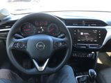 the interior of a car with a steering wheel and dashboard controls