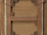 an old picture of a wooden frame with a picture in it