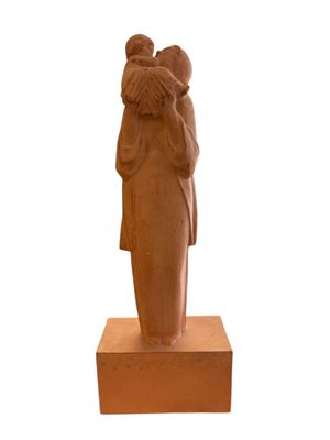 statue of a woman holding a child in her arms