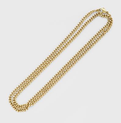 un collier à chaîne en or avec un fermoir sur fond blanc