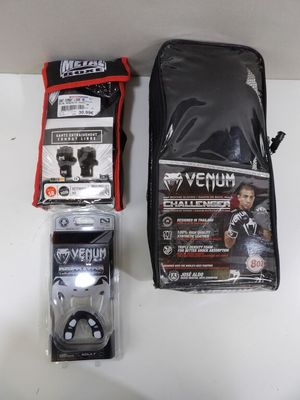 the contents of a bag and a pair of headphones are on a table