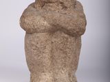 two stone sculptures of a man and a woman on a white background