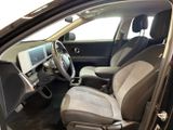 the interior of a car with the door open and the driver ' s seat down