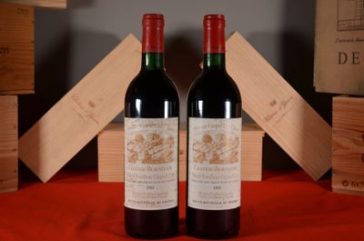 two bottles of wine sitting next to each other on a table
