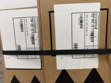two boxes are stacked on top of each other with labels on them