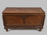 an old wooden chest with a metal latch on the top