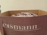 a cardboard box with a sign that says essmani on it