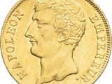 gros plan d'une pièce d'or portant un visage de femme