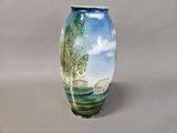 a vase with a picture of a farm on it