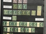 an image of a collection of stamps on display in a glass case
