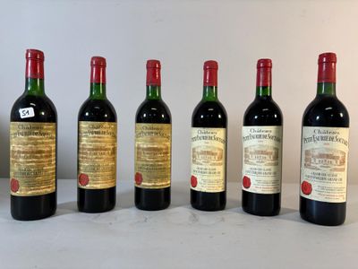 six bouteilles de vin sont alignées sur une table