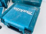 two makita tools sitting on top of a table next to each other
