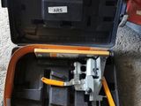 a tool in the case that is sitting on the floor