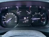 a close up of a car dashboard with a speedometer and gauges