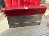 a red couch that is sitting on top of a table