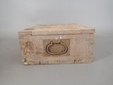 a small box with a handle on it on a table