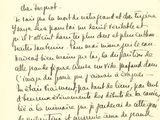 a close up of a handwritten letter on a piece of paper