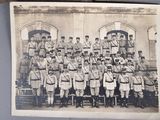 an old photo of a group of men in uniform