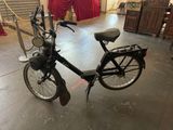 a bicycle that is parked in a garage