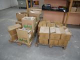 many boxes stacked up on pallets in a warehouse