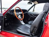 a red car with black seats and a steering wheel