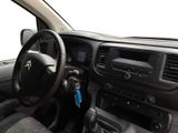 the interior of a car with a steering wheel and dashboard controls