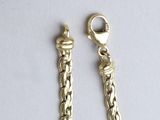 two pairs of gold chains with a clasp on each end