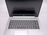 a laptop computer that is sitting on a white table