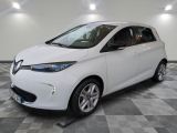 a picture of a white car parked in a garage
